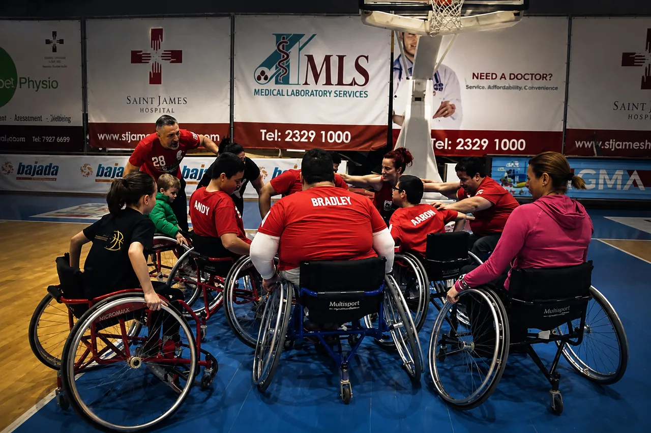 Malta Wheelchair Basketball Association team celebrating together